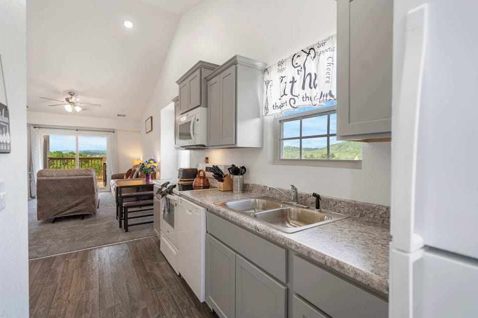 The open, airy kitchen offers ample space & every home comfort​