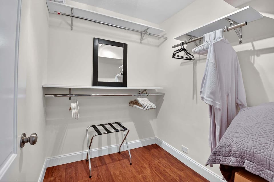 Keep clothes & bags neatly tucked away in the primary king suite’s closet​