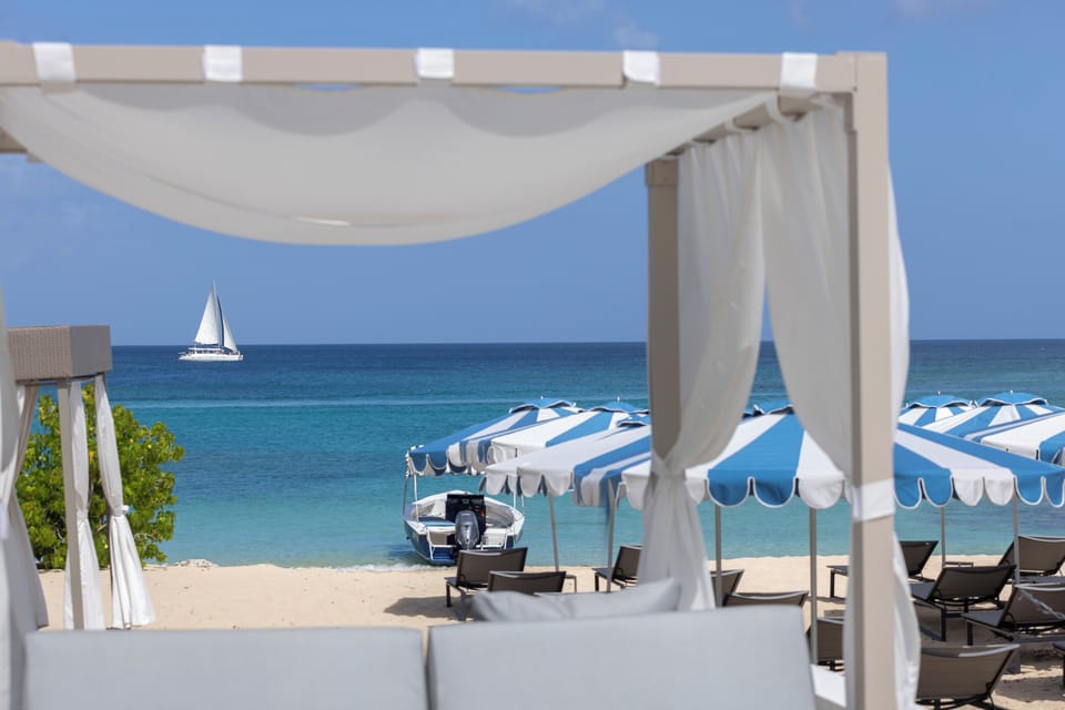 On the beach, beach cabanas, beach umbrellas, beach towels