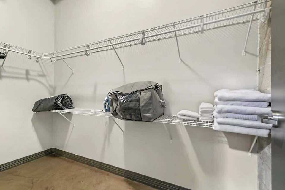 Stay organized with ample shelves and ironing essentials at your fingertips!