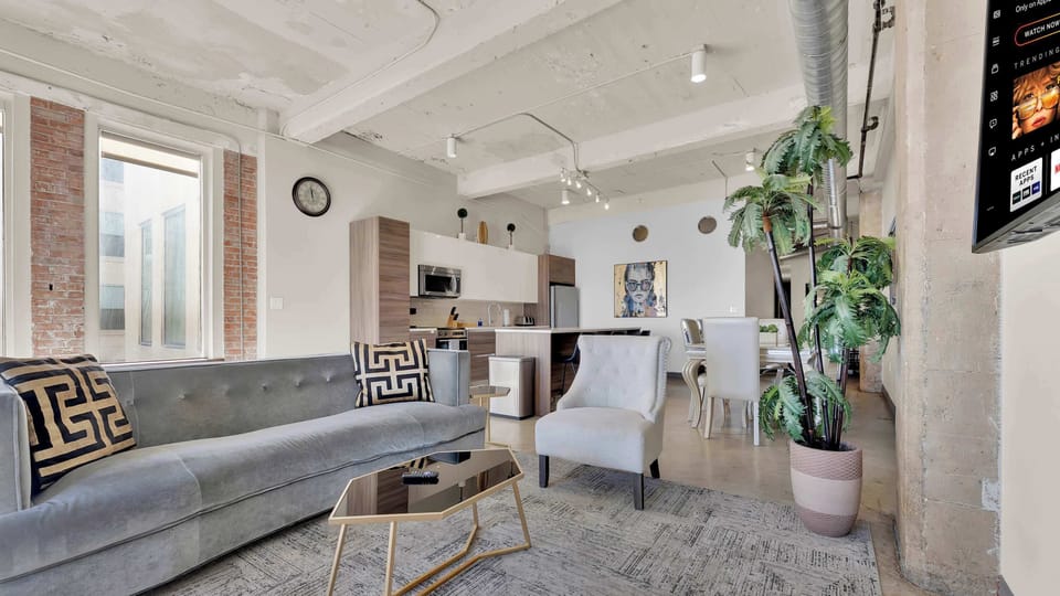Living Room: Art-infused elegance with modern comforts and city views awaits your getaway!