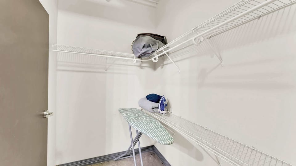 Laundry Room: Convenient space with ironing board and ample storage for a stress-free stay!