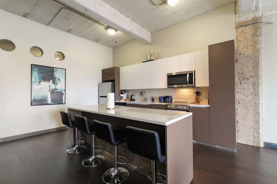 Whip up delicious meals in this sleek kitchen with stylish decor and vibrant accents!