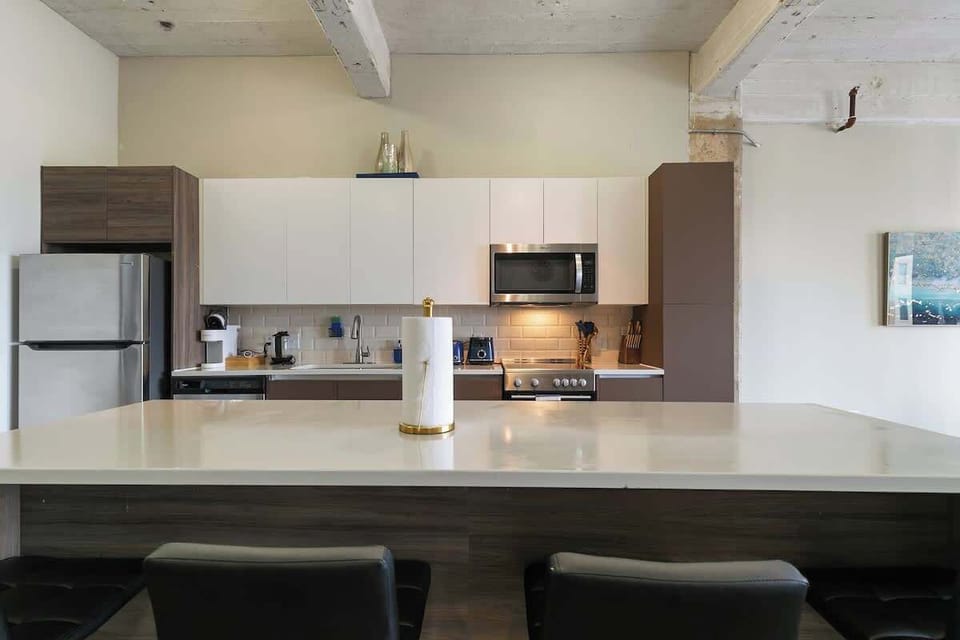 Whip up delicious meals in this sleek kitchen with stylish decor and vibrant accents!