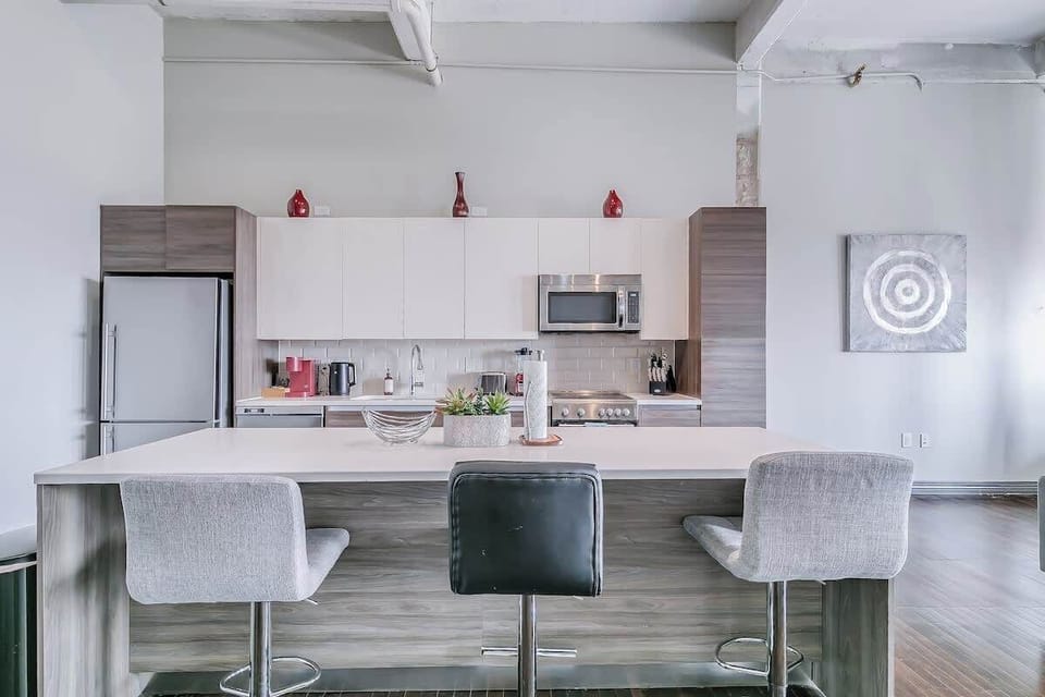 Whip up delicious meals in this sleek kitchen with stylish decor and vibrant accents!