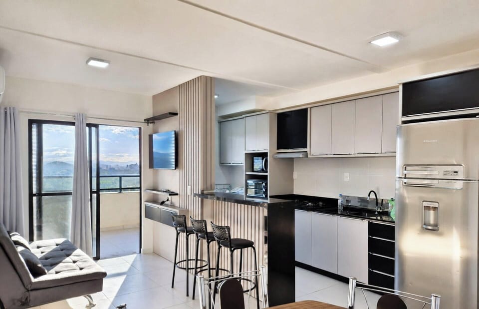 Deluxe Apartment, Pool Access, Beach View | Private kitchen | Dining table