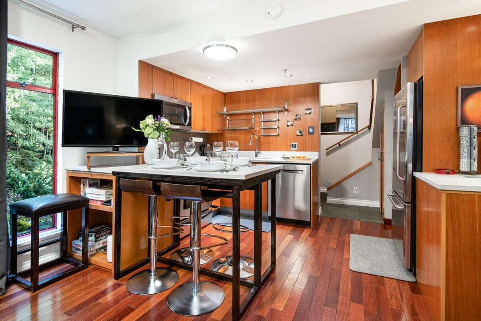 Warm wood interiors with dining area for four.