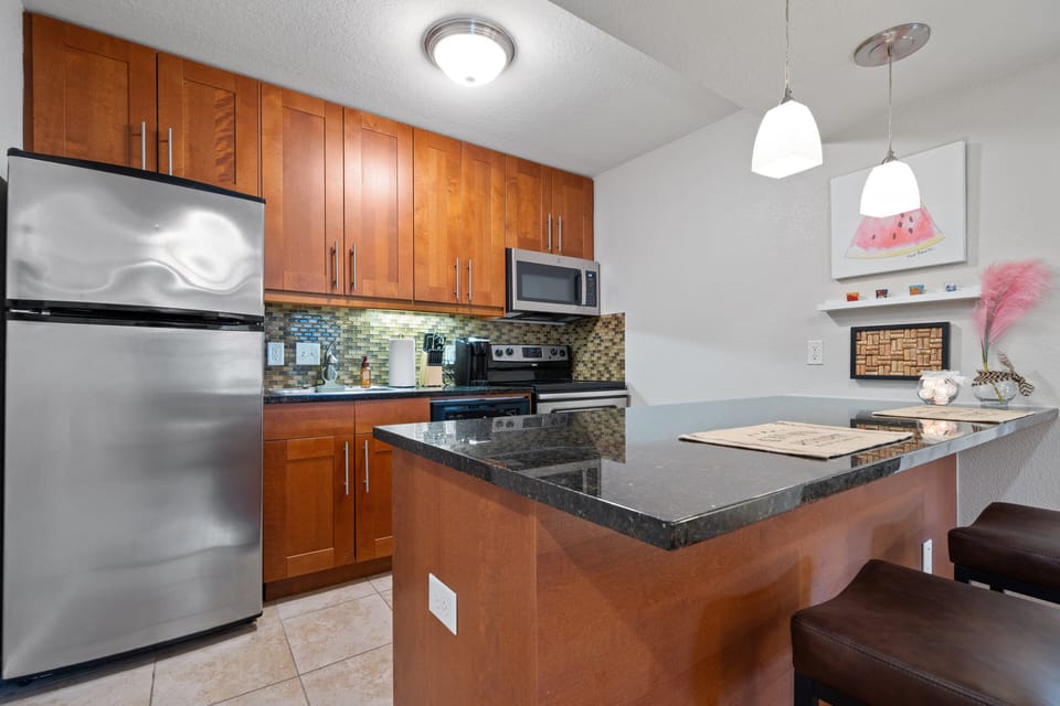 Spacious kitchen with breakfast barstools