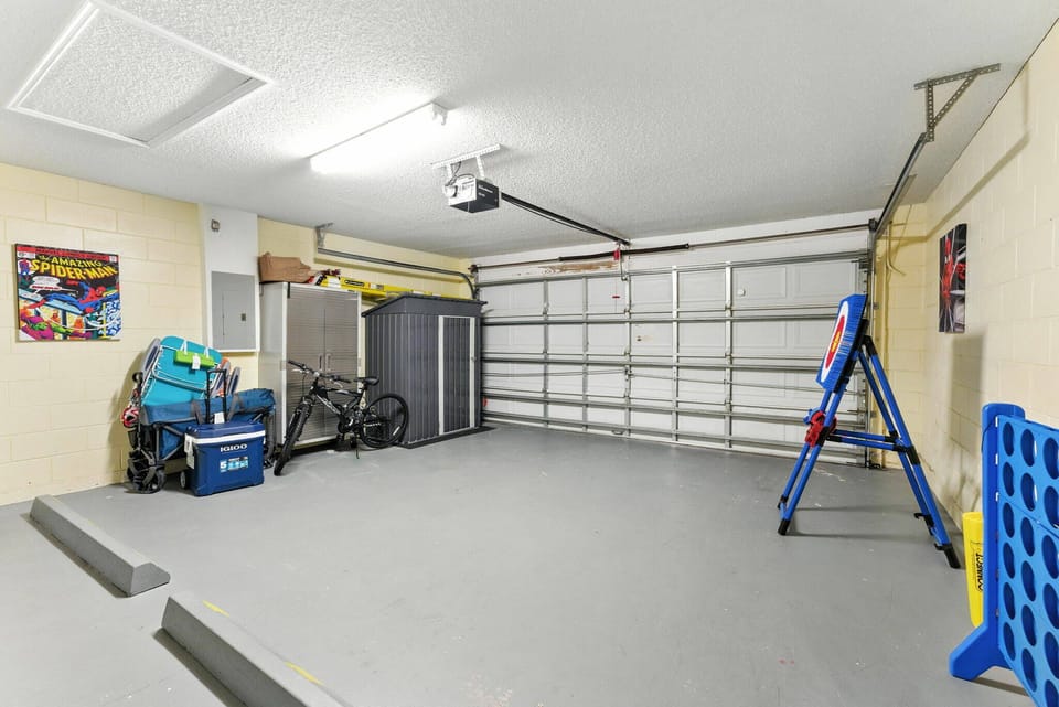 This spacious garage features a sleek, gray floor and ample room for your gear or vehicles, making it a practical addition to your stay. With organized storage and easy access, it's perfect for those ready to explore the area.