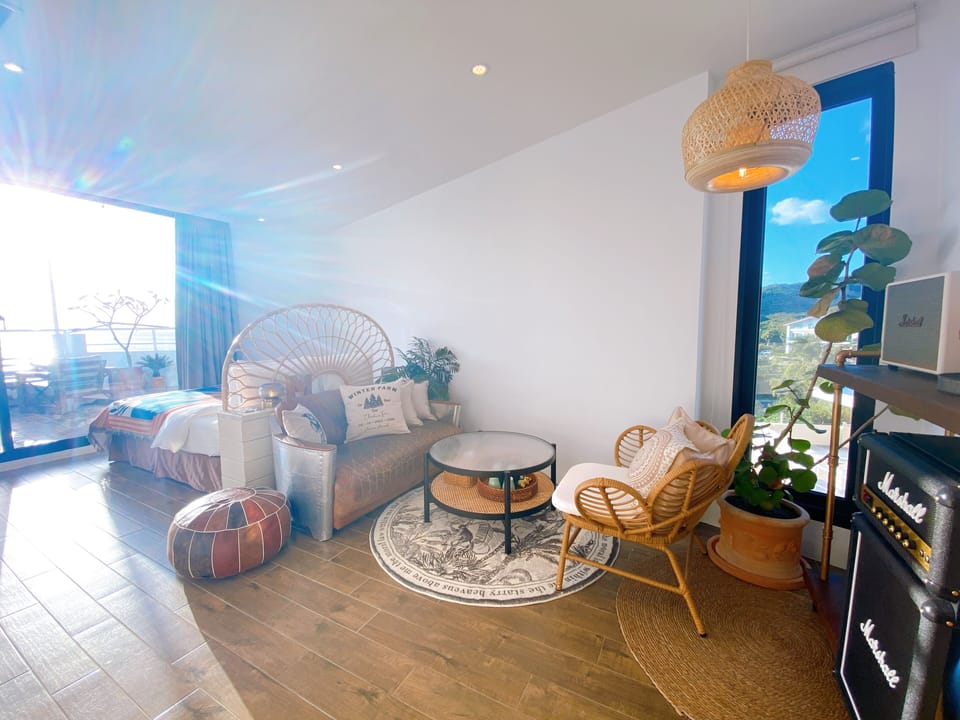 Gallery Penthouse | Living area | 42-inch flat-screen TV with cable channels, TV, smart speakers
