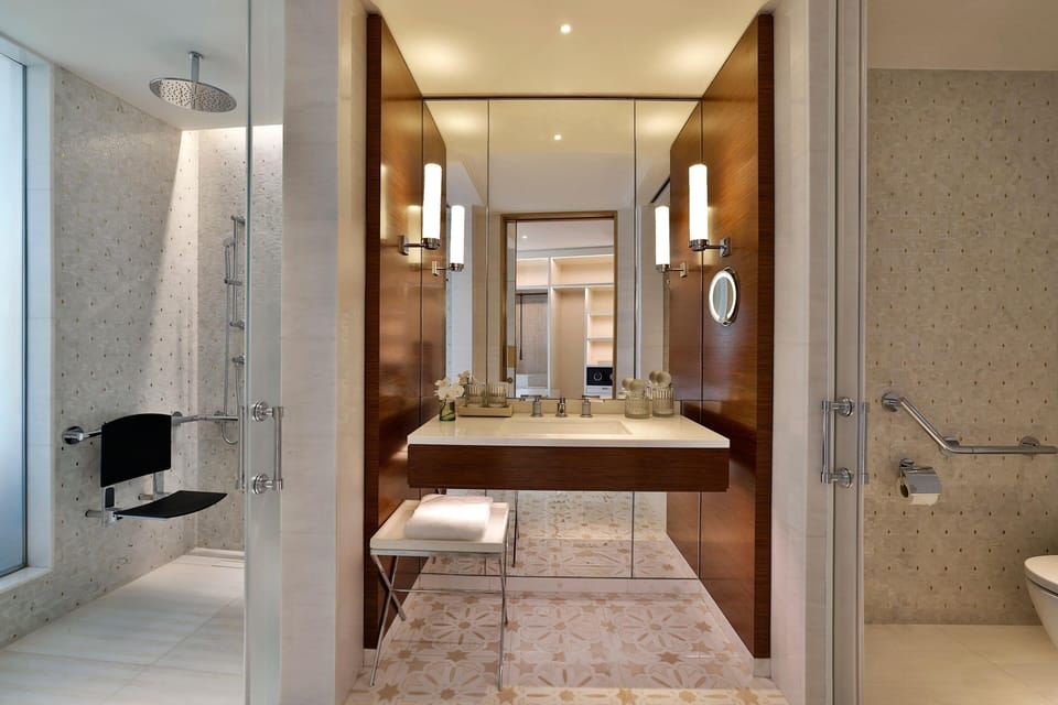 Deluxe Room, 1 King Bed, Accessible | Bathroom | Deep soaking tub, rainfall showerhead, designer toiletries, hair dryer