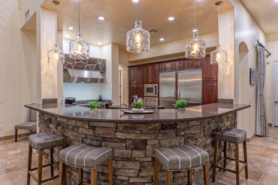 Curved counter offers bar seating for morning coffee, snacks and nightcaps.