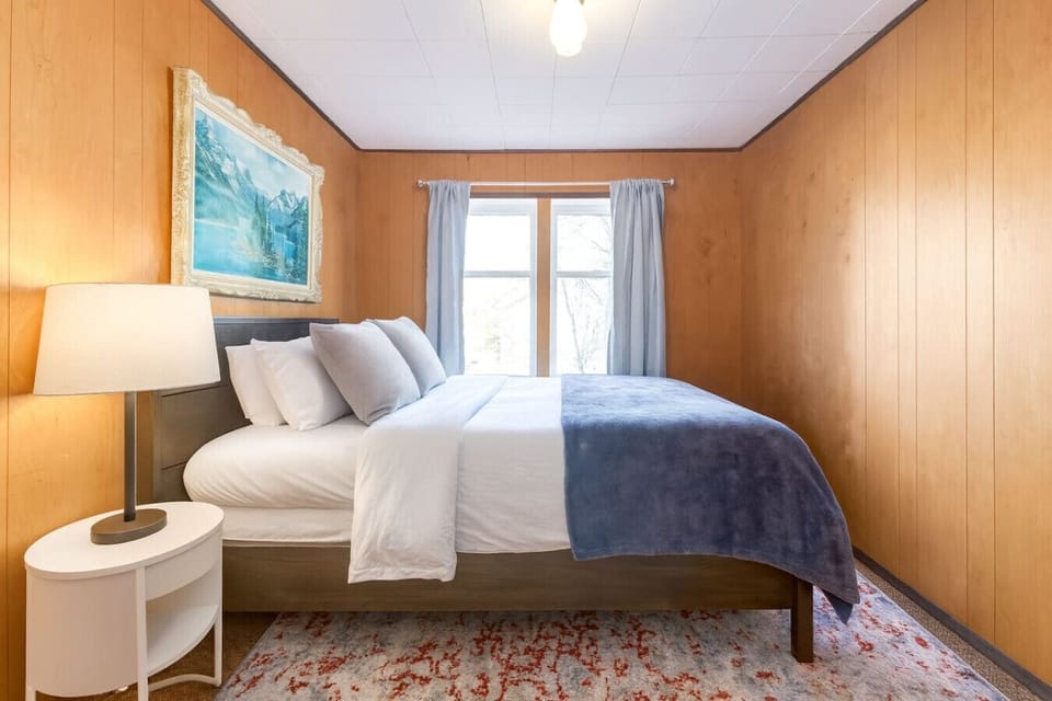 The queen bed is ideal for a restful sleep after a long day of adventure.