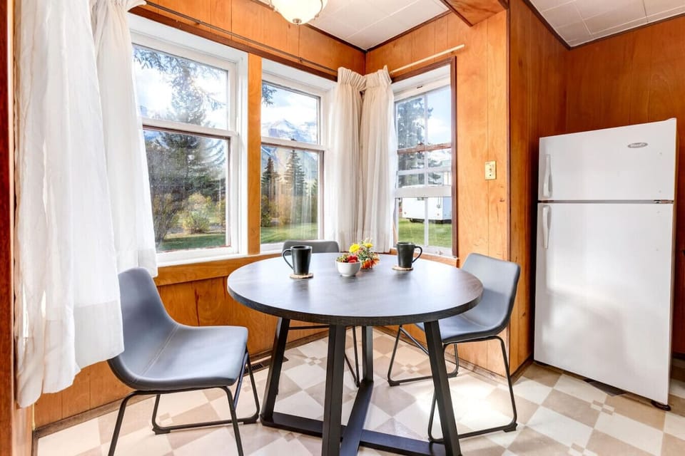 The dining area comfortably seats four, perfect for intimate meals and conversations.