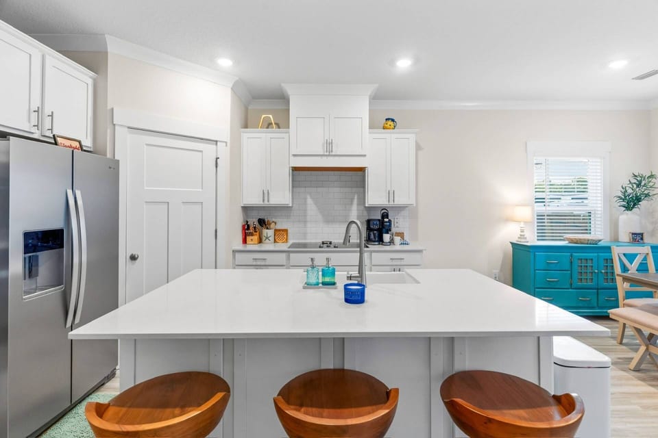 Bar seating for 3 at the oversized kitchen island