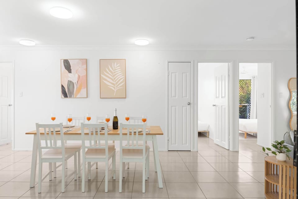 The dining table for six and seamless connection to the kitchen make it easy to gather for meals, while air conditioning keeps the entire space comfortable year-round.