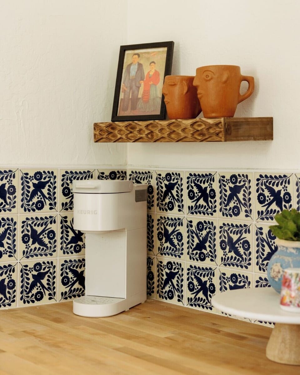 Our cozy kitchenette with a white Keurig coffee maker