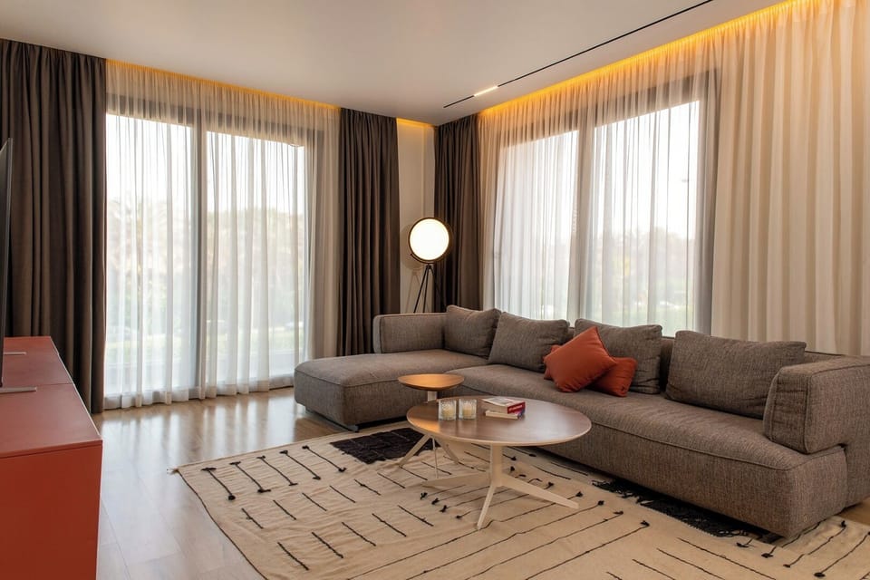 Apartment, Balcony, City View | Living area | Flat-screen TV
