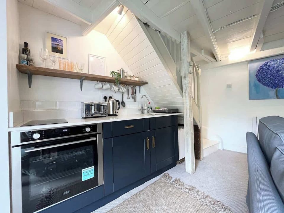 The kitchen area oven, toaster kettle and microwave available (fridge is a mini fridge without freezer)