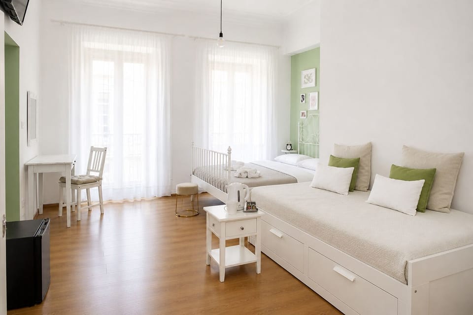 Quadruple Room, Balcony, City View | Minibar, desk, laptop workspace, free WiFi