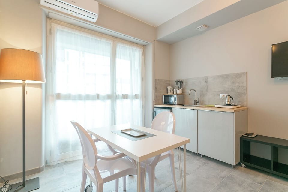 Apartment, 2 Bedrooms, Balcony | Private kitchen | Electric kettle, dining table