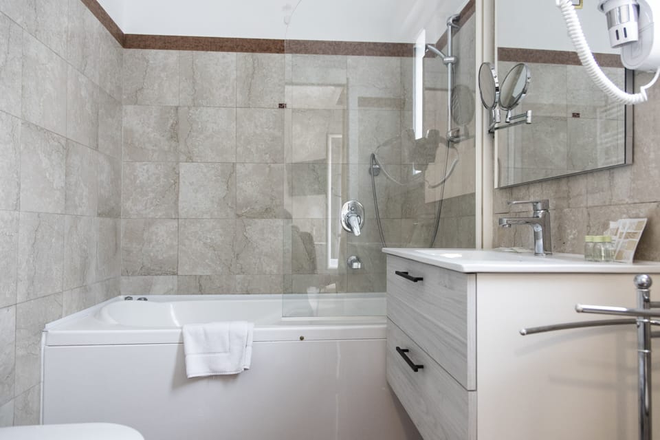 Hair dryer, bathrobes, bidet, towels
