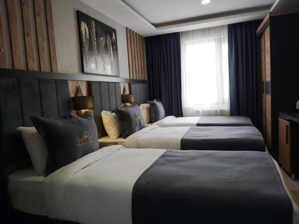 Triple Room, City View | In-room safe, desk, laptop workspace, soundproofing