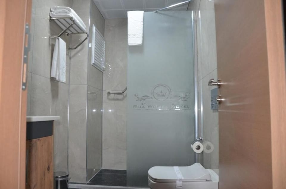 Shower, free toiletries, hair dryer, slippers