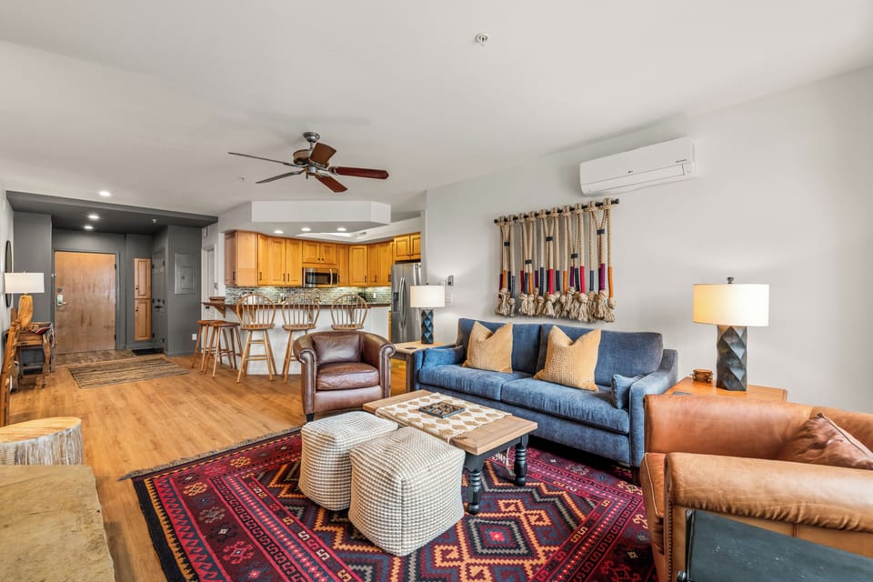 Relax in your beautifully appointed living space where southwestern style meets modern comfort, complete with cozy seating and mountain-inspired decor.