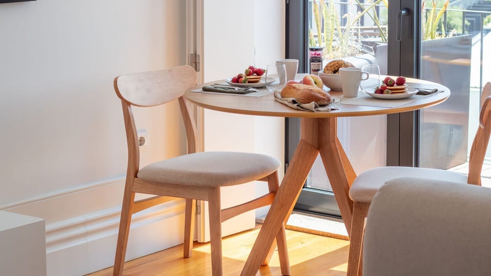 Start your morning in style with breakfast by the window, soaking in the Porto sun. #BreakfastSpot #CozyDining #FreshStart