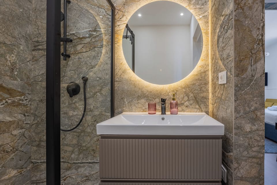 Triple Room, City View | Bathroom | Shower, hair dryer, bidet, towels