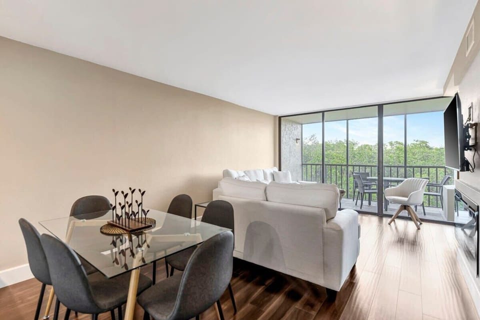 Your next favorite dining spot, complete with a cozy living area and a balcony breeze!