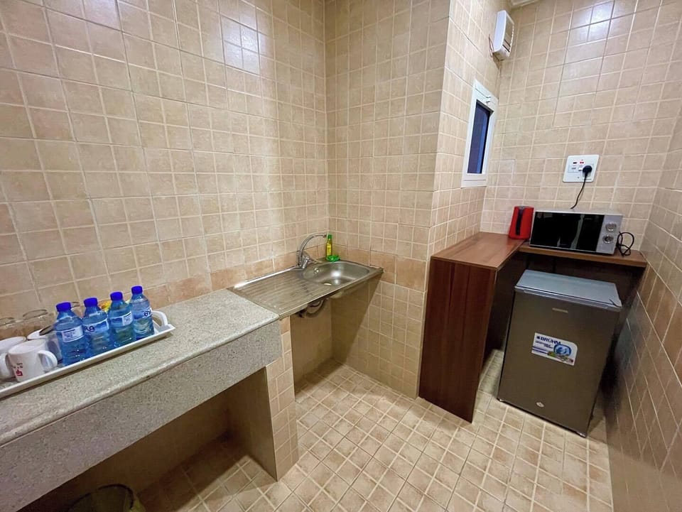 Economy Room, Balcony, City View | Private kitchen | Mini-fridge