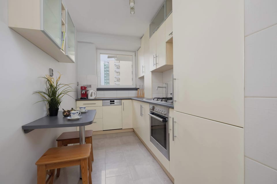 A modern kitchen equipped with cabinets, a stove, oven, and ample countertop space.