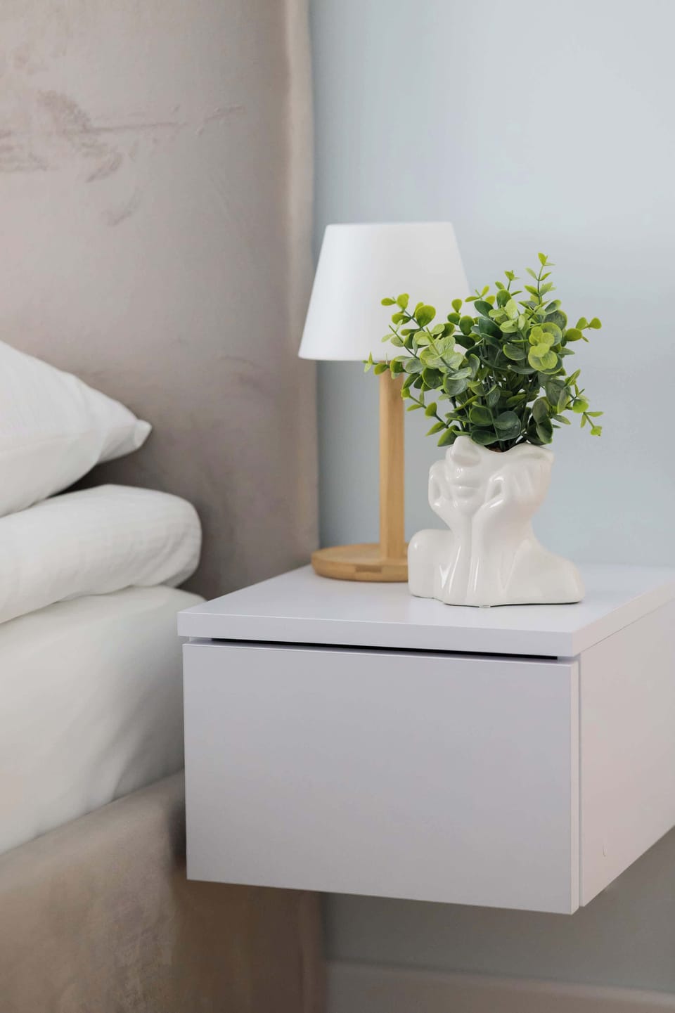 The bedroom's elegant decor creates a serene and restful environment.
