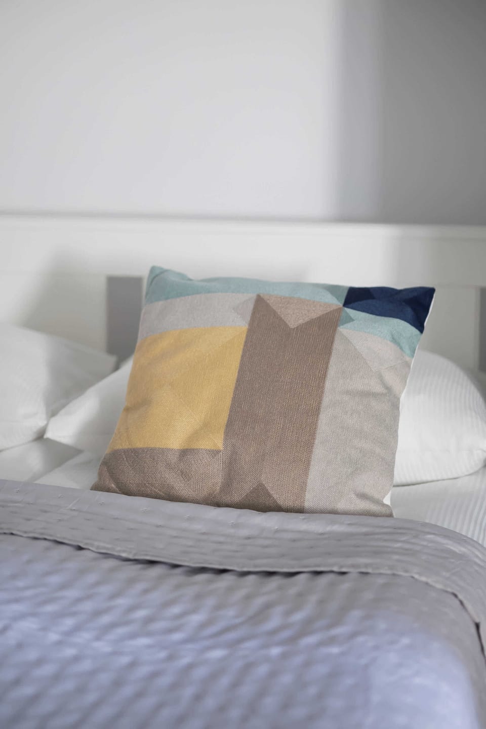 The bedroom's modern design ensures a comfortable stay.