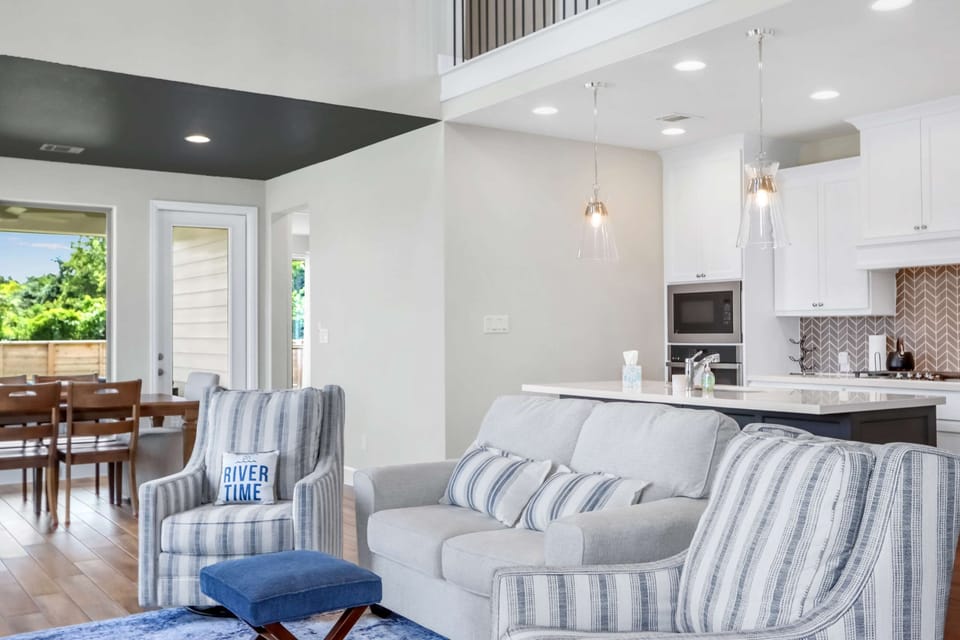 Curl up in the airy living room & stream your favorites on the smart TV​