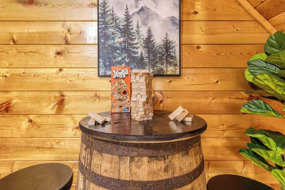 Gather around the rustic whiskey barrel table for a fun tabletop game in the cozy game loft.