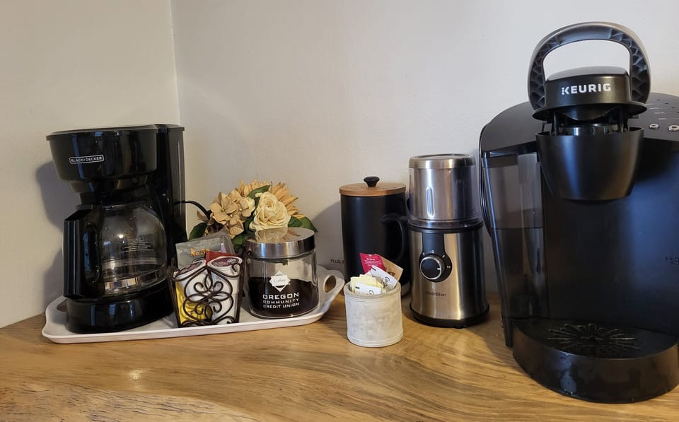 Coffee bar with French press, traditional drip, Keurig, grinder, and more.