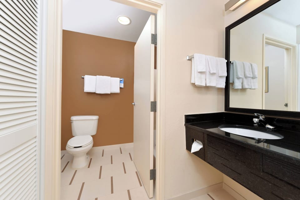 Room, 2 Double Beds | Bathroom | Combined shower/tub, free toiletries, hair dryer, towels