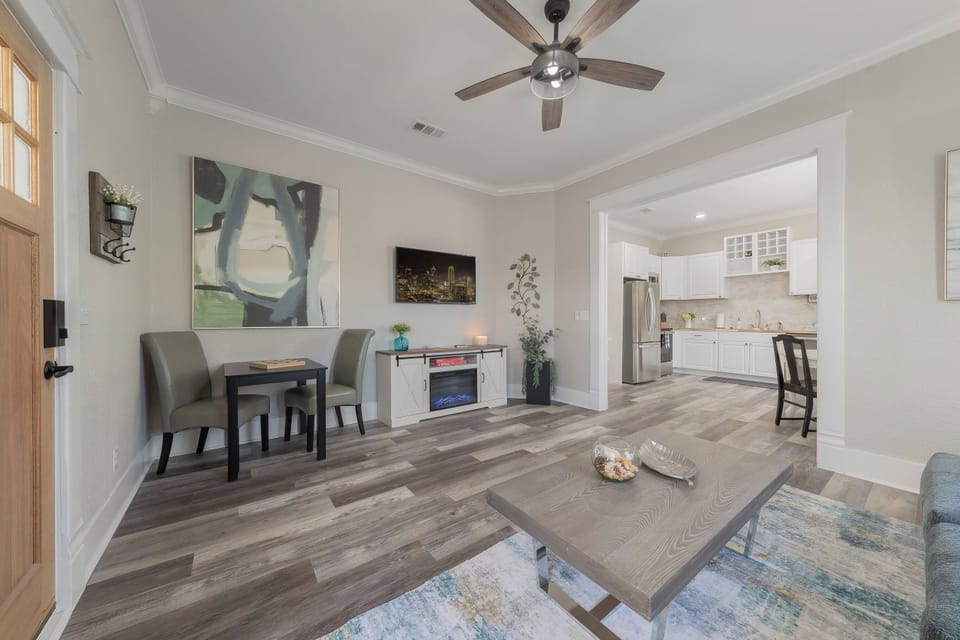Living including game table with chairs that can also be used at dining table