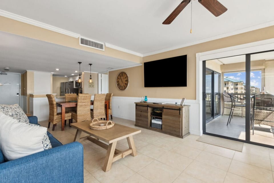 Living room with cable tv and access to balcony