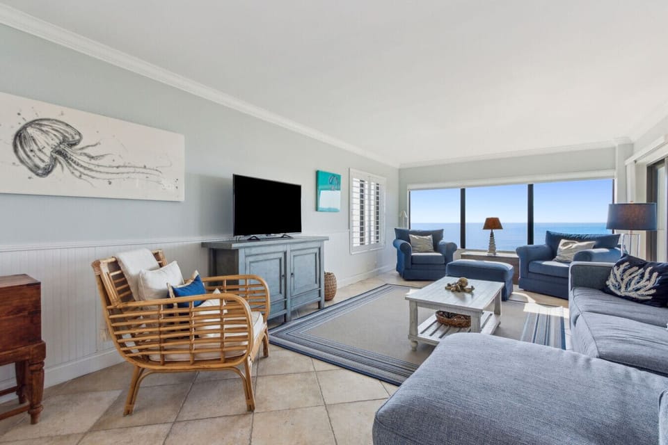 Living room with cable tv and Sliding glass door to balcony