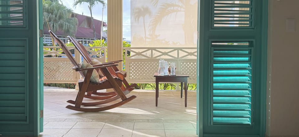 Double doors open the living room into the front balcony making it 1 large room 