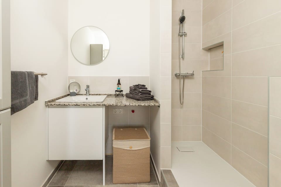 Newly updated bathroom with sleek fixtures and bright lighting.
