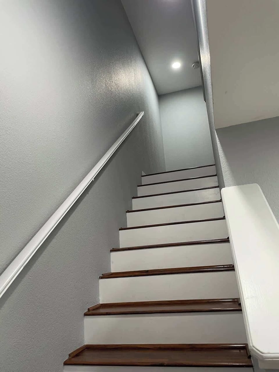 Stairs to upstairs bedrooms and bathrooms.