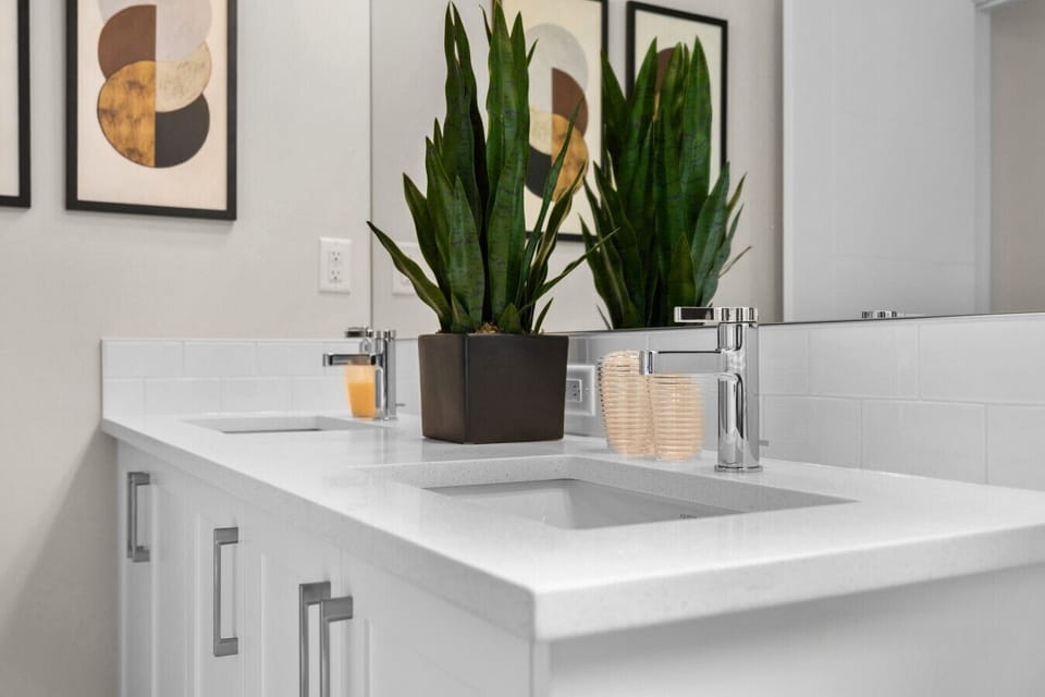 Spacious double-sink vanity with quartz counters and stylish decor for the whole family