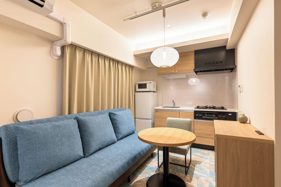 Deluxe Double Room | Living area | Flat-screen TV