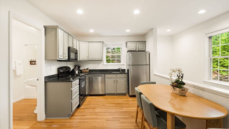 Everything you need to cook a real meal is here — full-size range, dishwasher, stainless steel appliances, and two windows of daylight. Skip the restaurant and do the mountain version of brunch.