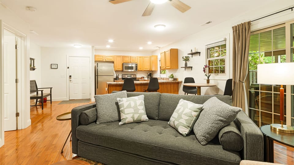 Unfold the lush green sofa into a queen sleeper, and your group of three or four is fully covered.